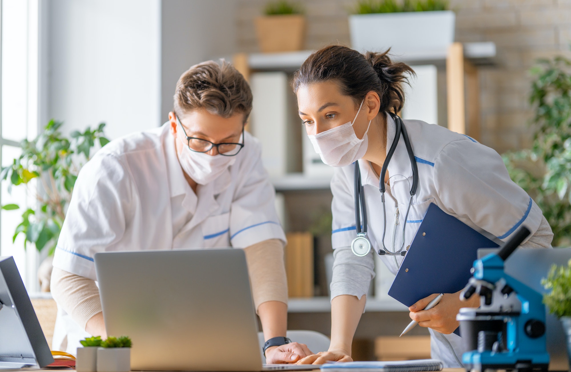Two clinicians reviewing a wound care plan together